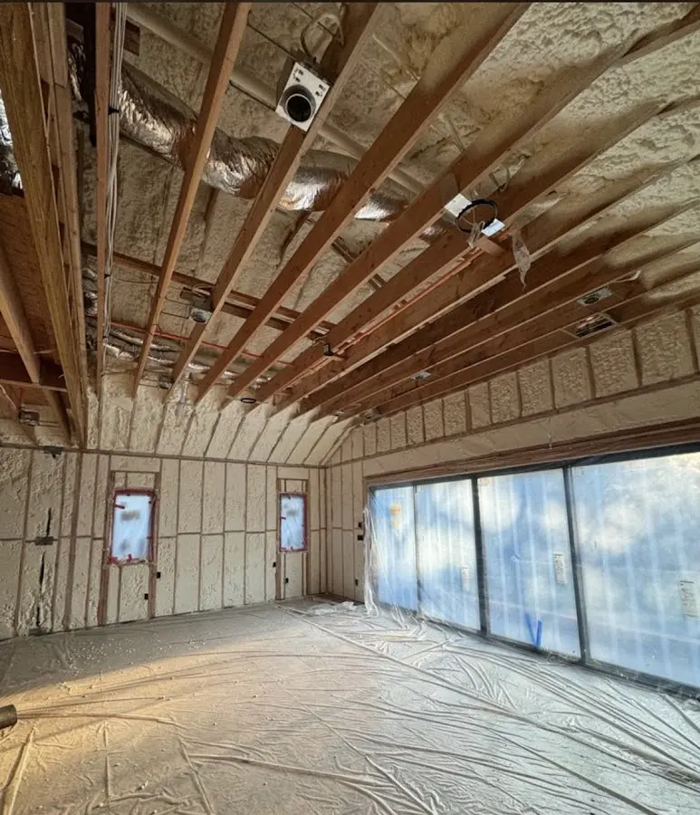 Interior walls and ceiling insulated with spray foam during new construction in McKees Rocks